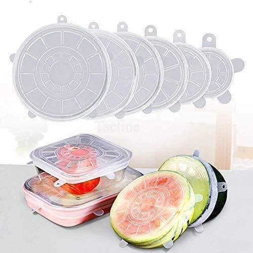 Six clear silicone lids in a row from large to small, with lids covering boxes and cut melon